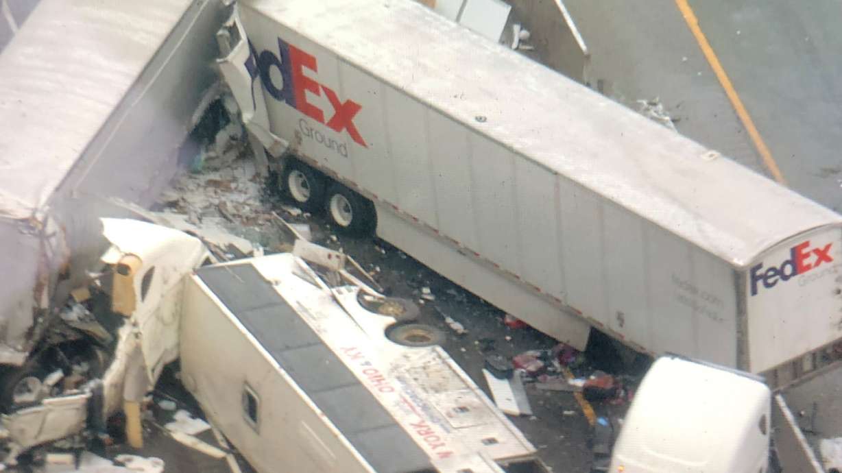 Investigators say bus passed truck before wreck killing 5