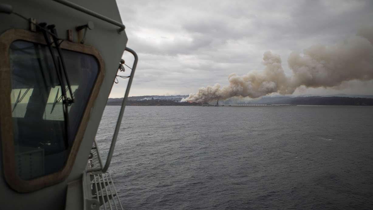 Australian crews race to contain blazes as damage bill soars