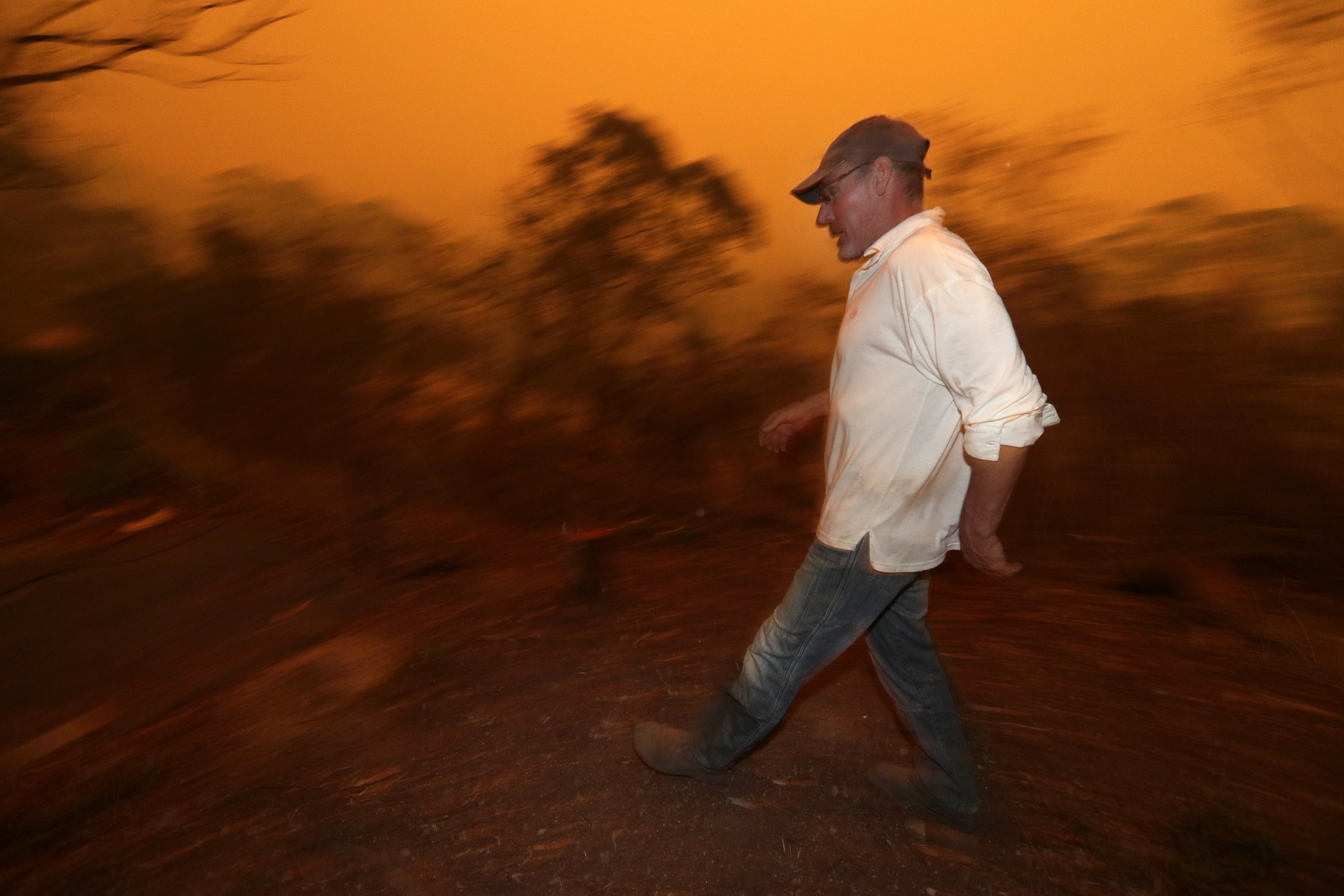 2 Aussie wildfires merge into inferno; man seriously burned