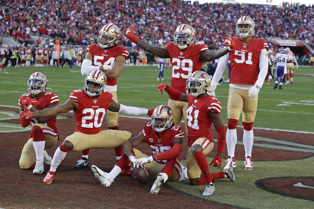 San Francisco 49ers players celebrate as a group after cornerback Richard Sherman (25), bottom center, intercepted a pass against the Minnesota Vikings during the second half of an NFL divisional playoff football game, Saturday, Jan. 11, 2020, in Santa Clara, Calif. (Photo: Marcio Jose Sanchez, AP)