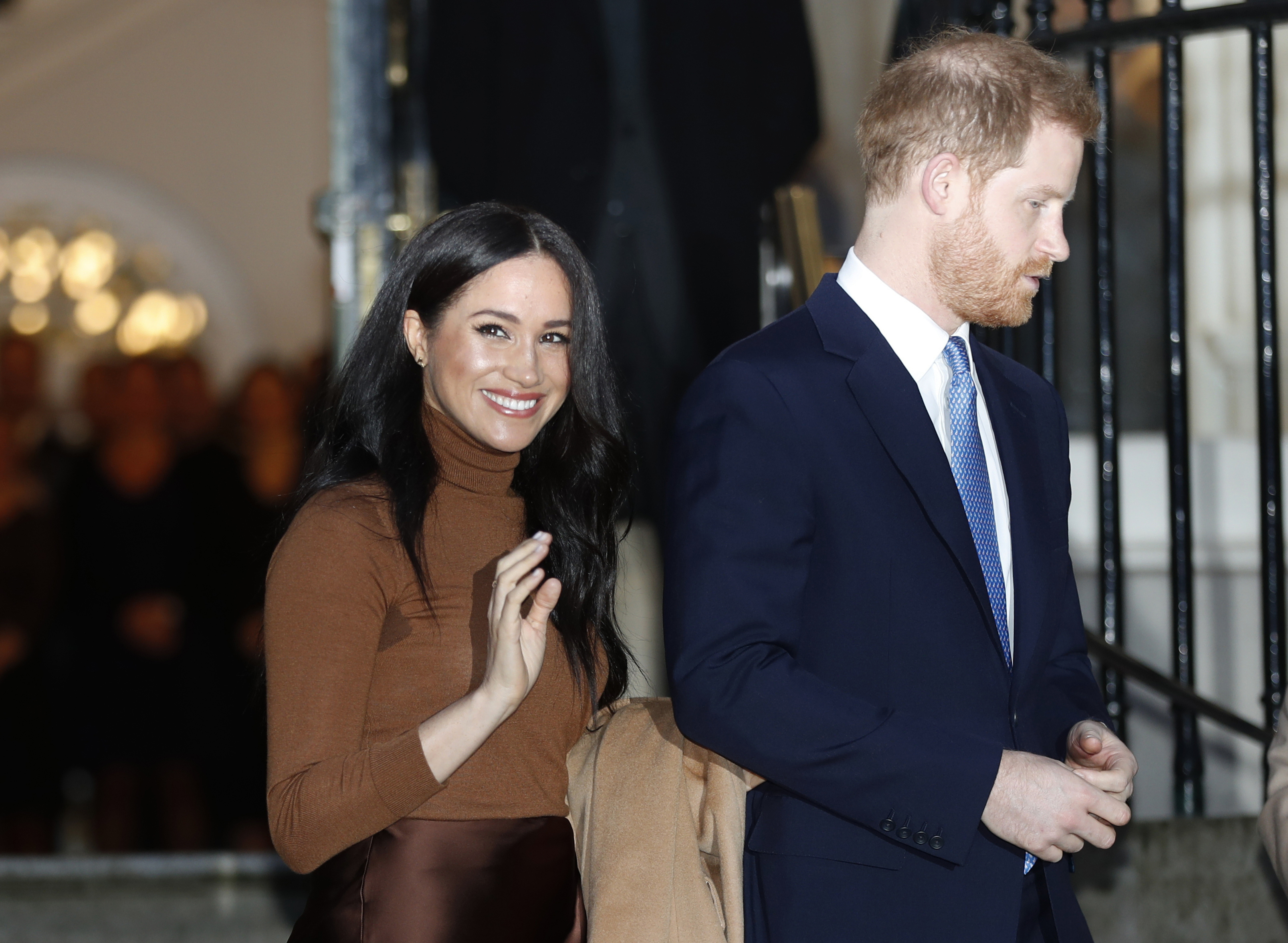 Questions of racism linger as Harry, Meghan step back