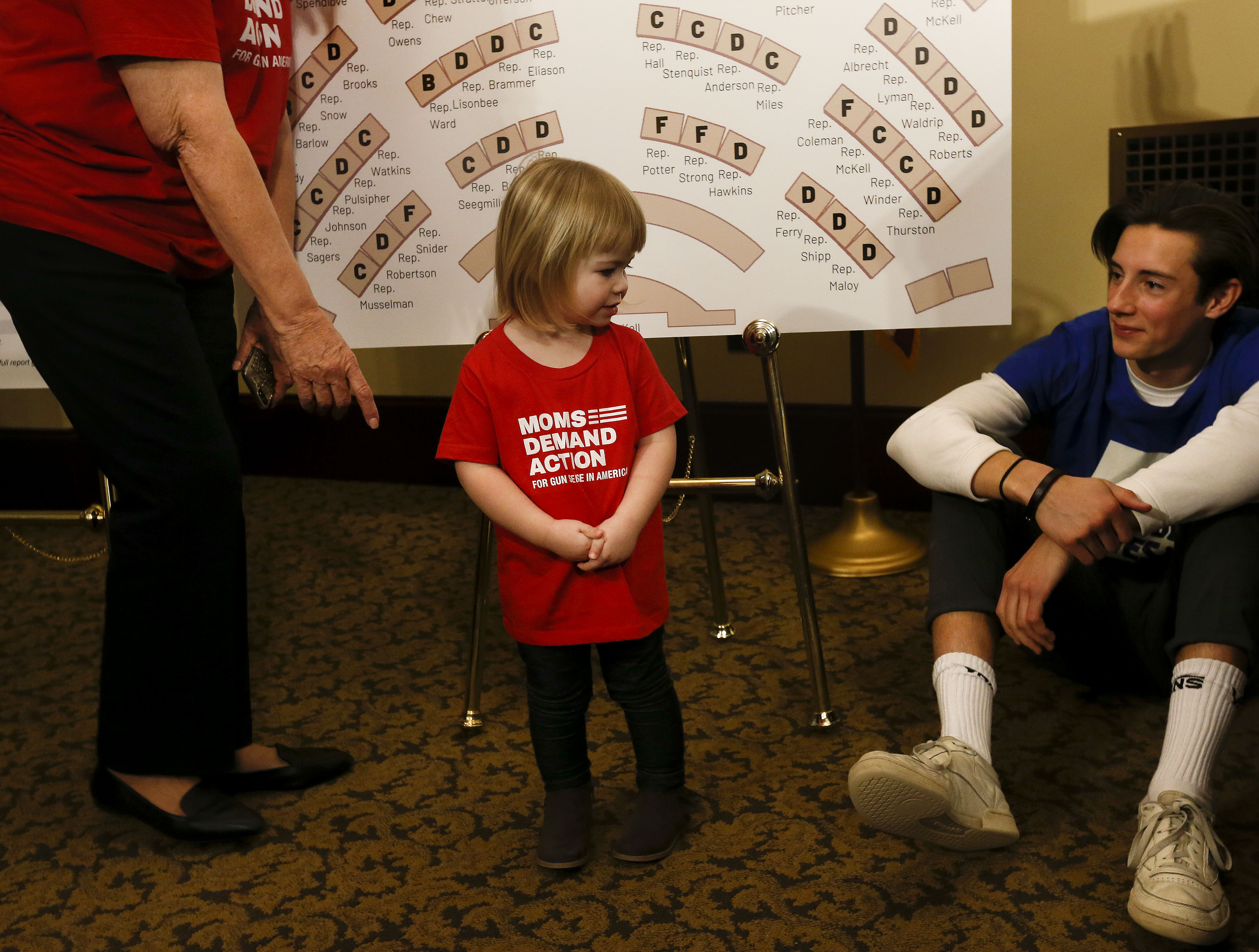 Andoni Telonidis, a member of March for Our Lives Utah and a senior at West High School, right, speaks to 3-year old Keaton Hansen after a press conference at the Capitol in Salt Lake City on Wednesday, Jan. 15, 2020, where high school students voiced their concerns about gun violence and presented a report card for Utah legislators based on their voting records during the 2019 legislative session. (Photo: Laura Seitz, KSL)