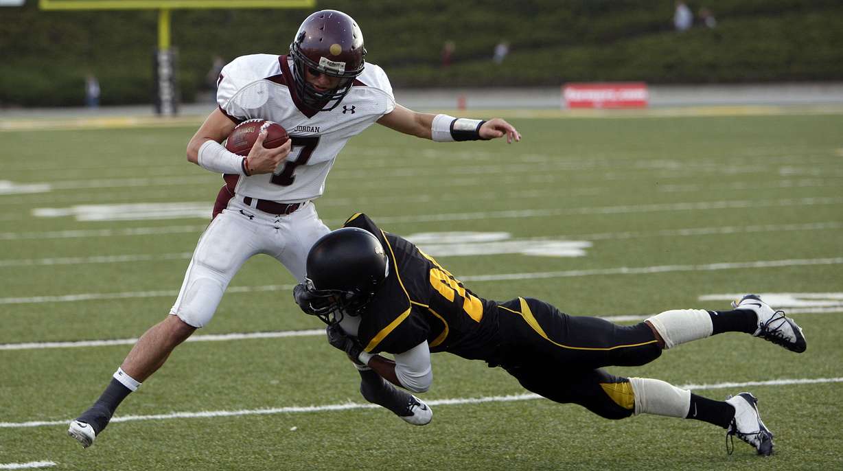 Taylor Loomis of Jordan is pushed out of bounds by Isaac Haas of Cottonwood in a high school playoff football at Cottonwood High School in Murray, Nov. 5, 2010. For the 2020 football season, Cottonwood, along with Payson, Timpanogos and Judge Memorial, will compete as an independent. (Photo: Ravell Call, KSL)