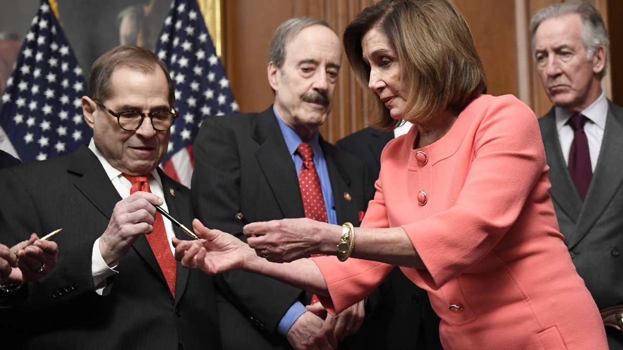 Nancy Pelosi hands out impeachment pens, a signing tradition