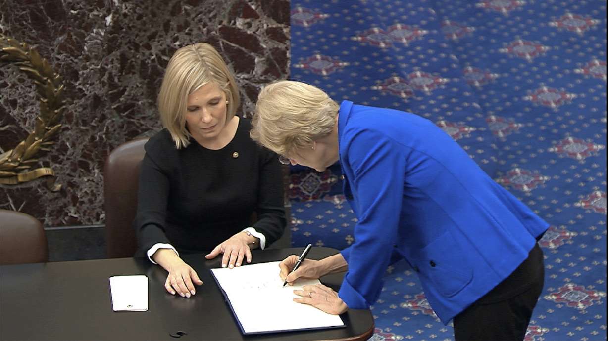 Book it: Senators sign long-used oath book for impeachment
