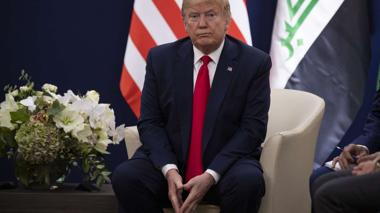 Holding court in Davos, Trump distracted by impeachment