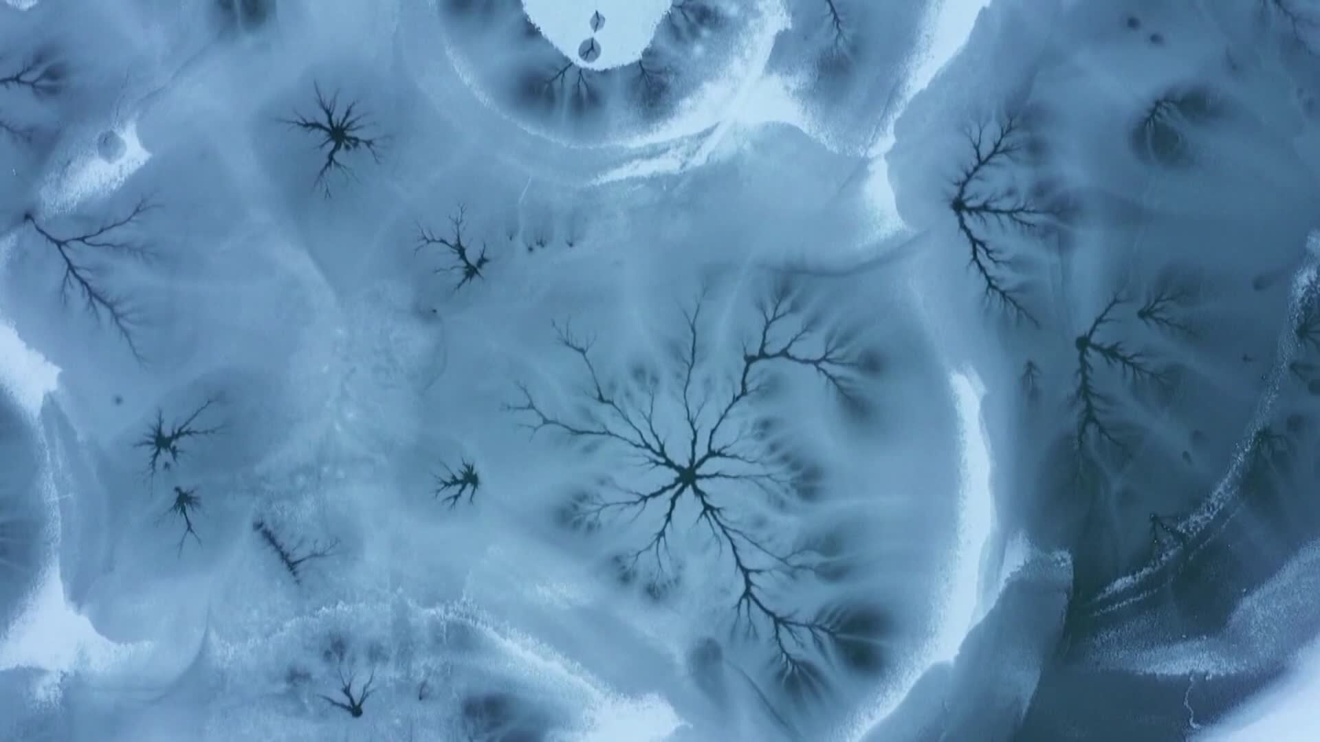 This frozen lake looks like the inside of a kaleidoscope