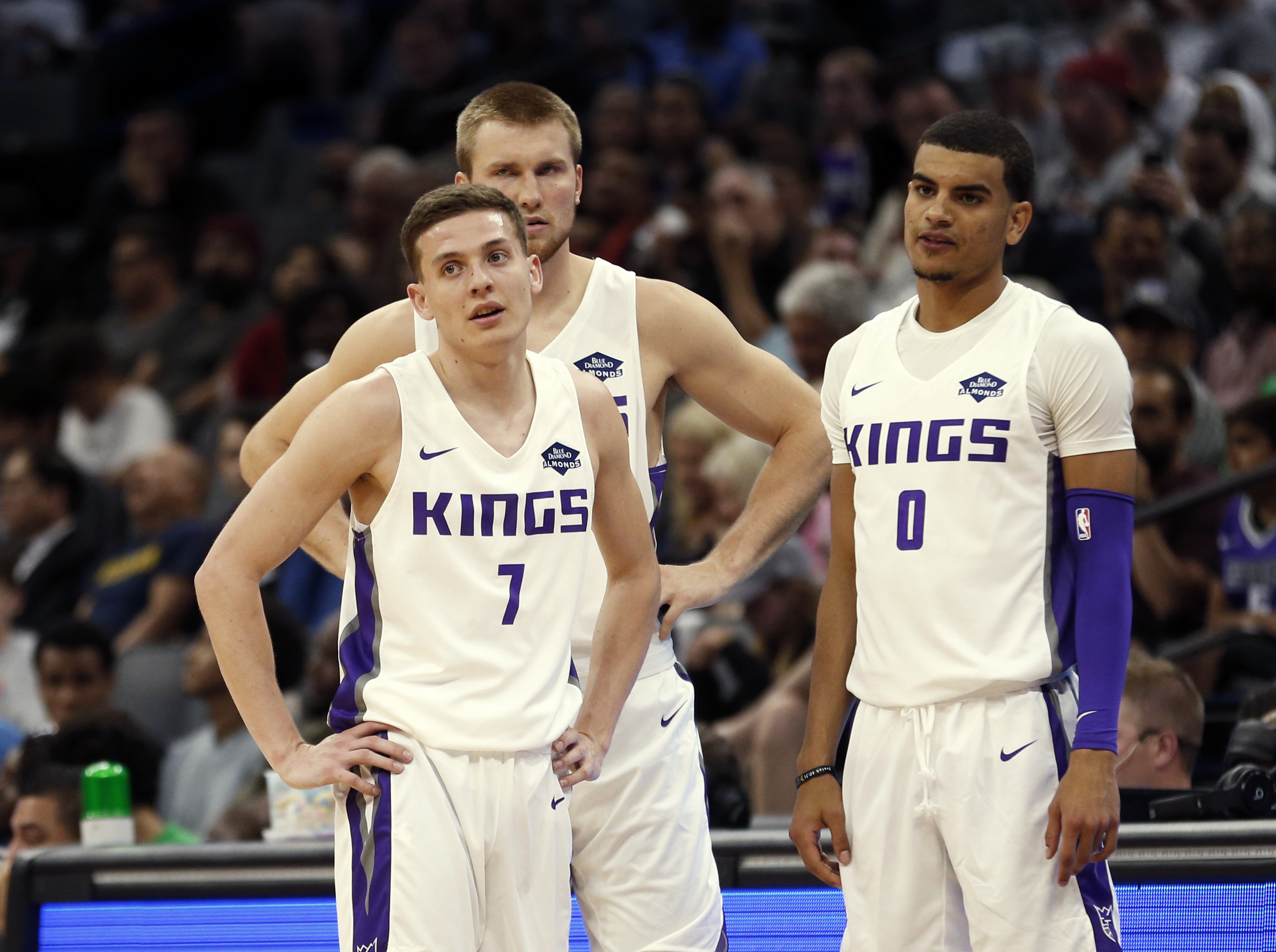 Sacramento King's Kyle Guy, left, Eric Mika, center, and Justin James watch as free throws are shot during the first half of an NBA basketball summer league game against the Golden State Warriors in Sacramento, Calif., Monday, July 1, 2019. The Kings won 81-77. (Photo: Rich Pedroncelli, AP)
