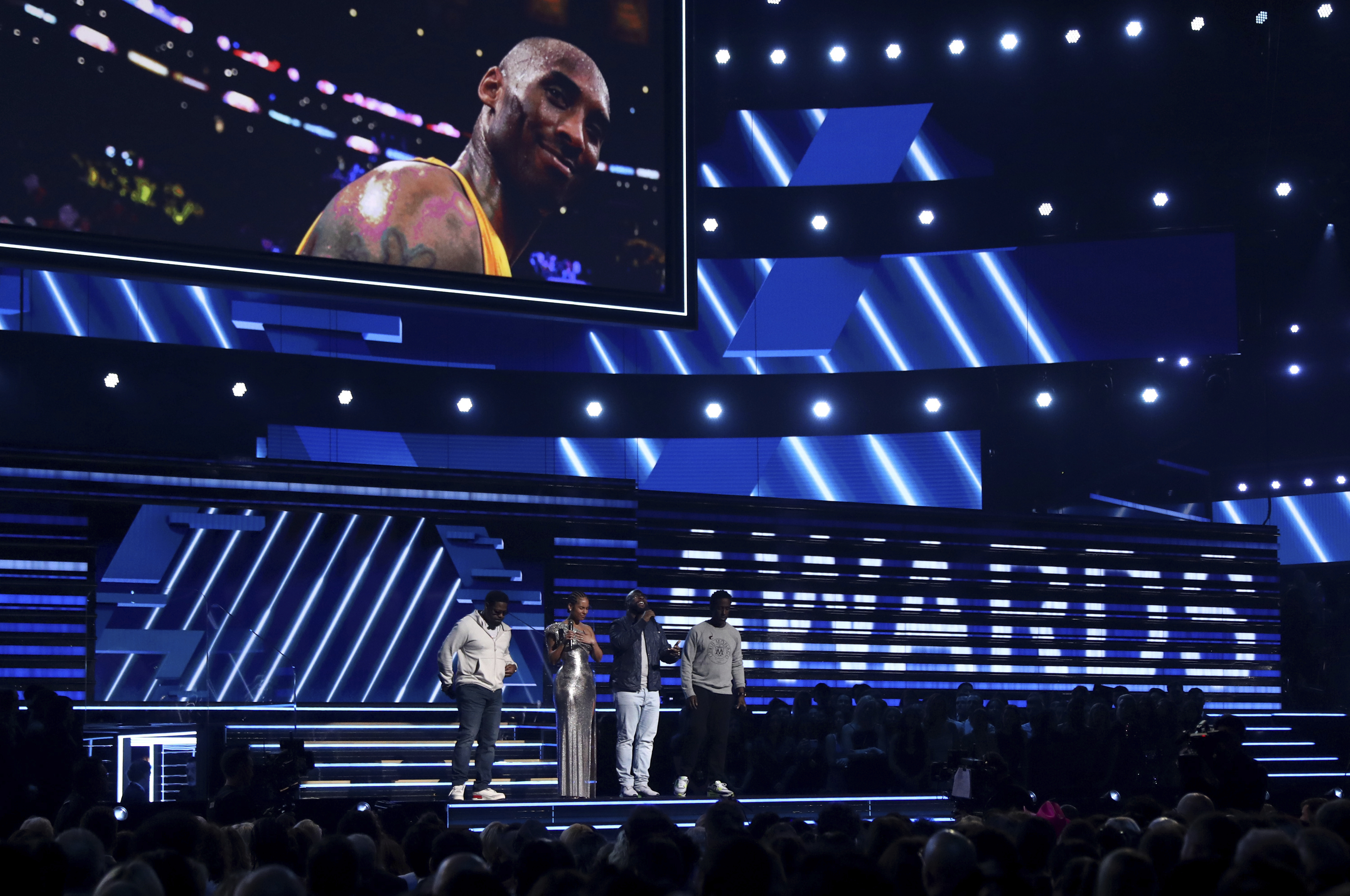 Alicia Keys, second left, and members of Boys II Men, from left, Nathan Morris, Wanya Morris and Shawn Stockman, sing "It's So Hard to Say Goodbye to Yesterday" during a tribute to the late Kobe Bryant, seen on screen, at the 62nd annual Grammy Awards on Sunday, Jan. 26, 2020, in Los Angeles. (Photo: Matt Sayles/Invision/AP)