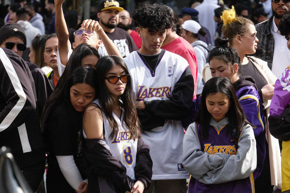 Fans gather at a memorial for Kobe Bryant near Staples Center Monday, Jan. 27, 2020, in Los Angeles. Bryant, the 18-time NBA All-Star who won five championships and became one of the greatest basketball players of his generation during a 20-year career with the Los Angeles Lakers, died in a helicopter crash Sunday. (Ringo H.W. Chiu, AP Photo)
