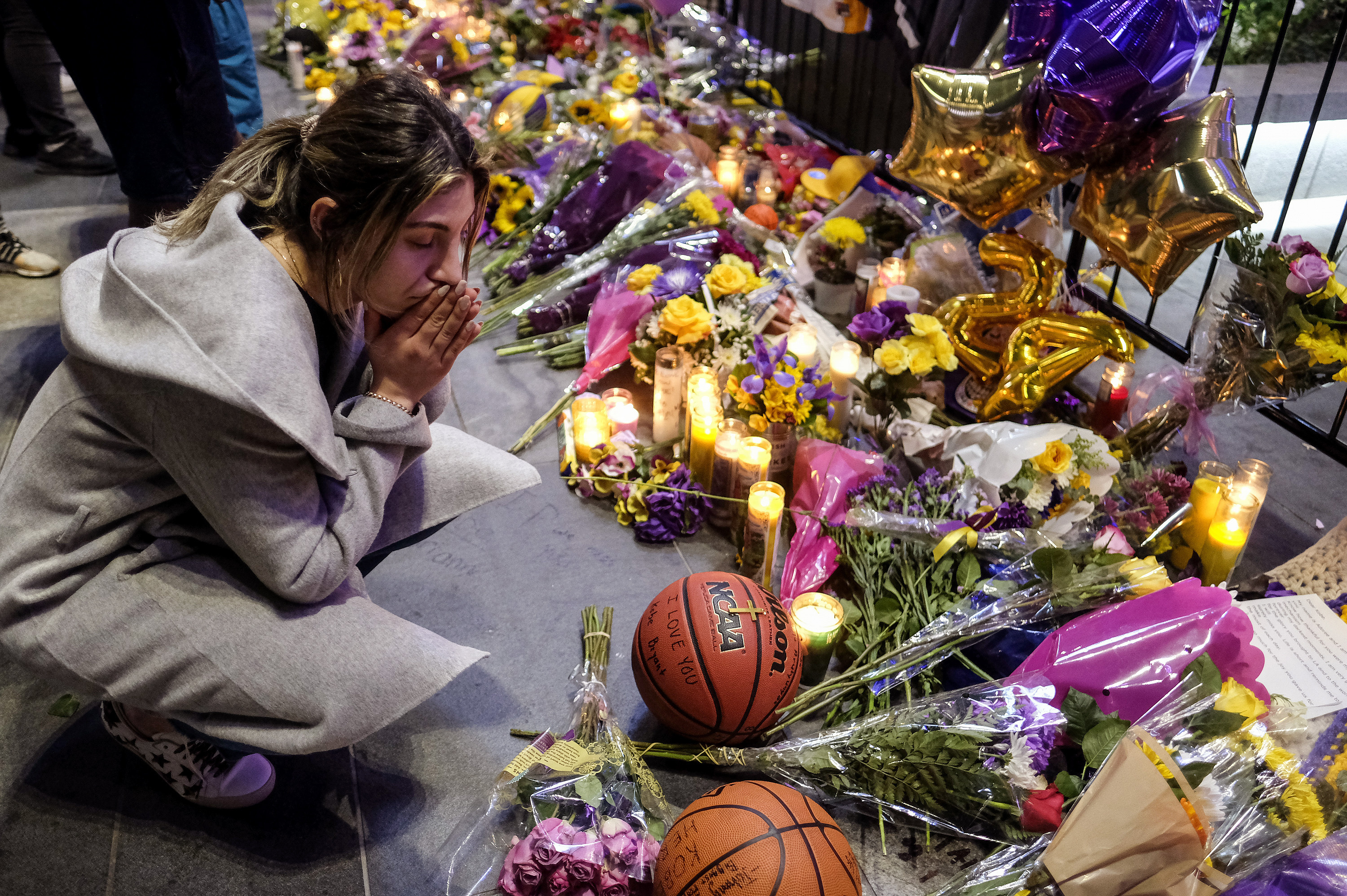 Fans pay respect at a memorial for Kobe Bryant near Staples Center Monday, Jan. 27, 2020, in Los Angeles. Bryant, the 18-time NBA All-Star who won five championships and became one of the greatest basketball players of his generation during a 20-year career with the Los Angeles Lakers, died in a helicopter crash Sunday. (Ringo H.W. Chiu, AP Photo)