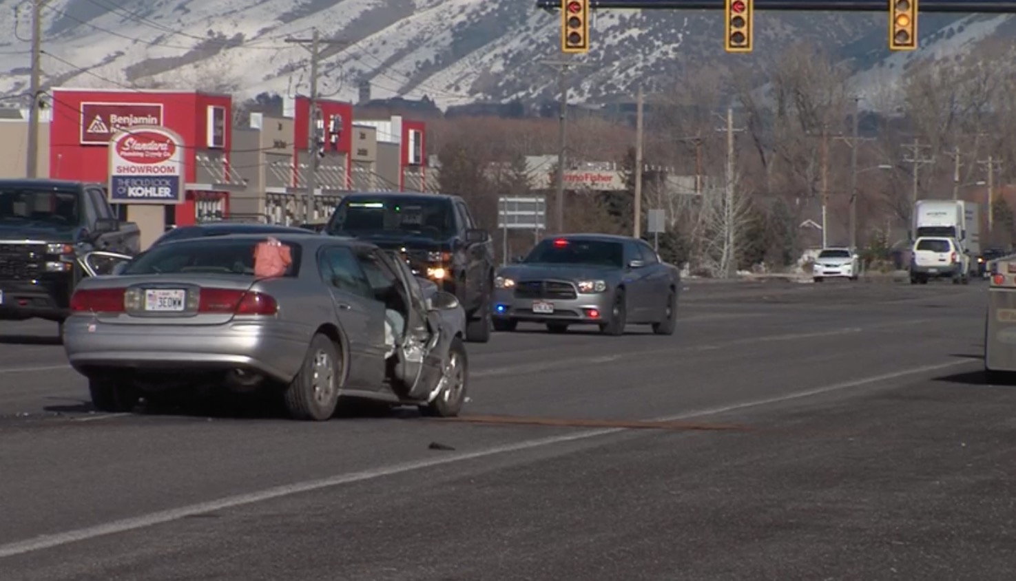 Police: Possibly intoxicated woman hospitalized after car crash with infant in backseat