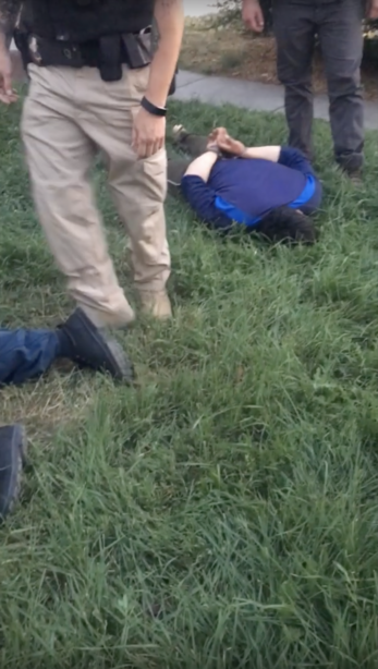 A screen grab from video provided by the ACLU of Utah shows a member of the Yañez family in handcuffs after Adult Probation and Parole agents entered their home on Aug. 20, 2018. The family has filed a lawsuit against the agency claiming agents used excessive force. American Civil Liberties Union of Utah
