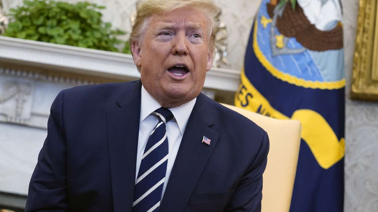 President Donald Trump talks during a meeting in the Oval Office of the White House, Jan. 27, 2020. Lawyers for E. Jean Carroll who accuses Trump of raping her in the 1990s are asking for a DNA sample, seeking to determine whether his genetic material is on a dress she says she wore during the encounter.