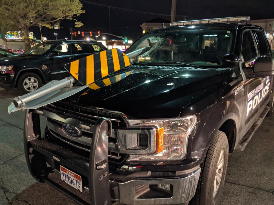 Video: Median sign struck, ricochets into West Jordan police car’s windshield