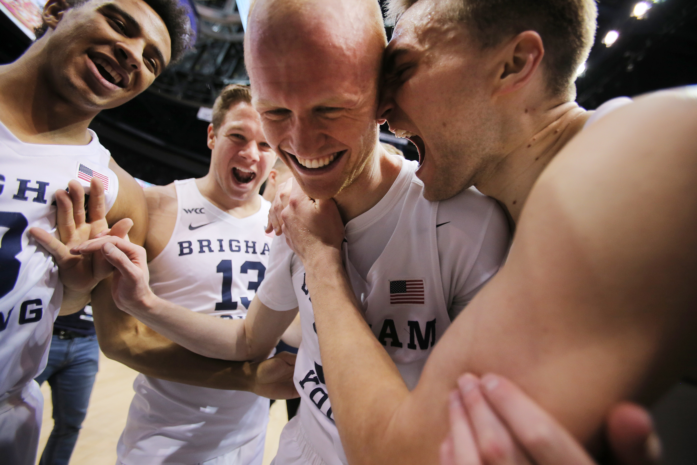 Brigham Young Cougars guard TJ Haws (30) is swarmed by teammates as BYU celebrates a win over Saint Mary’s in an NCAA basketball game in Provo at the Marriott Center on Saturday, Feb. 1, 2020. BYU won 81-79. (Photo: Scottt G Winterton, KSL)