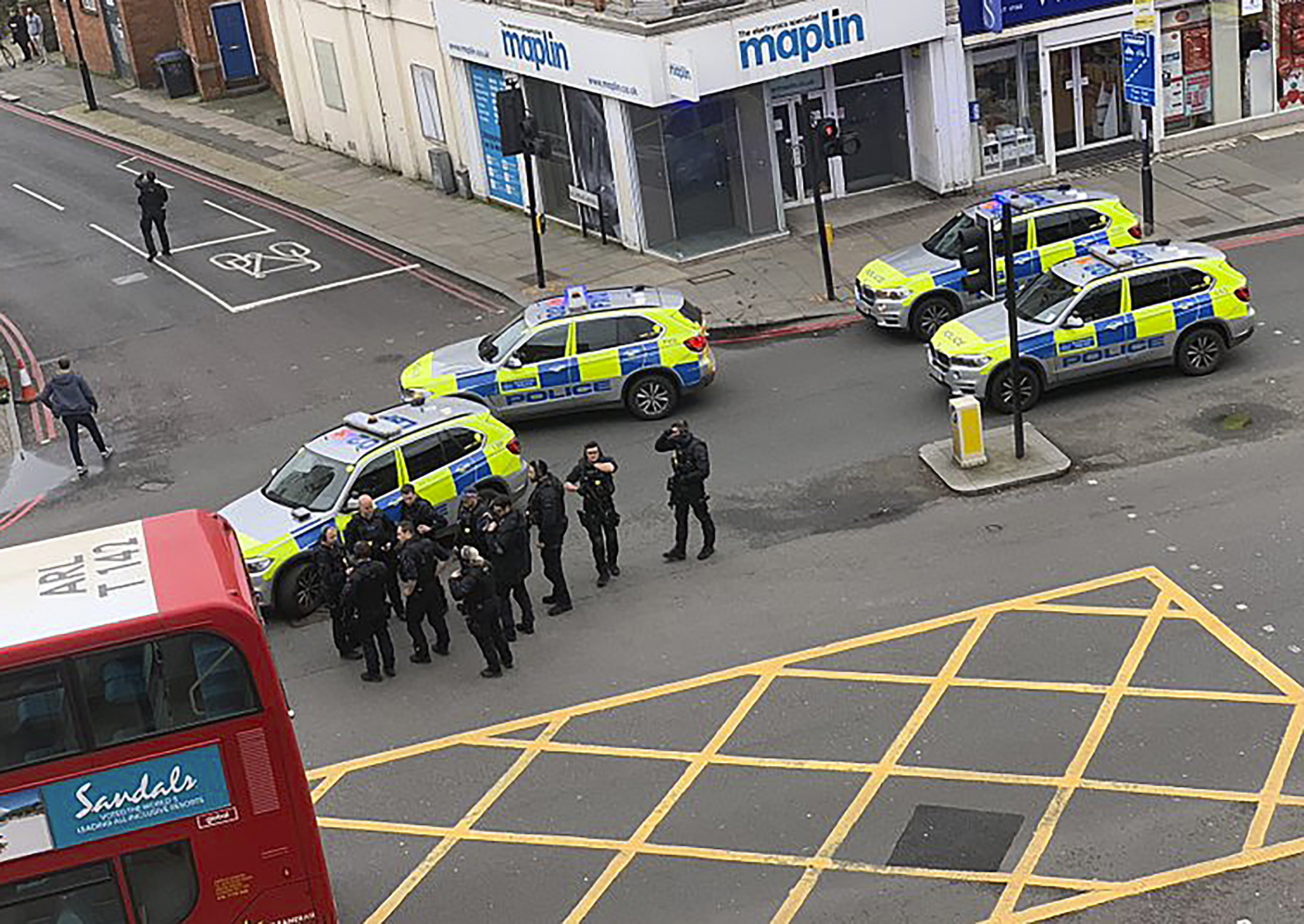 Man wearing fake bomb stabs 2 in London and is shot to death