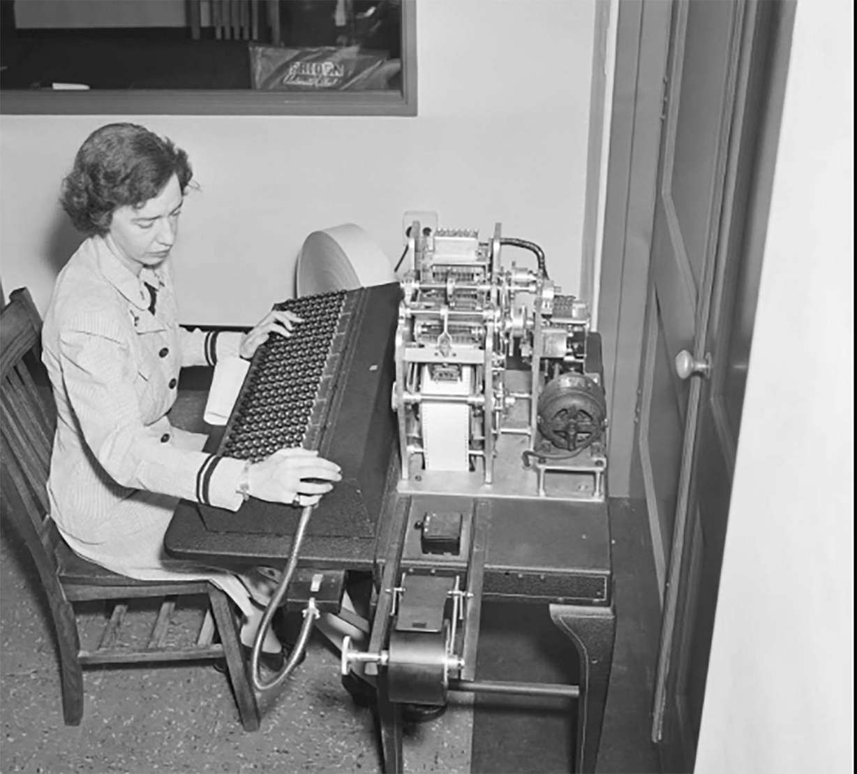 Computer scientist Grace Hopper works on a manual tape punch, an early computer. Photo: Bettmann Archive/Getty Images