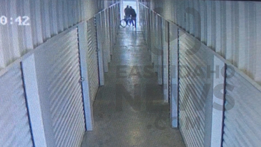 Two men are seen moving bikes into the storage unit. (Photo: Self Storage Plus)