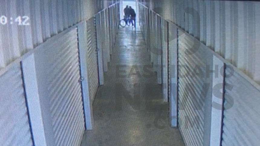 Two men are seen moving bikes into the storage unit. (Photo: Self Storage Plus)