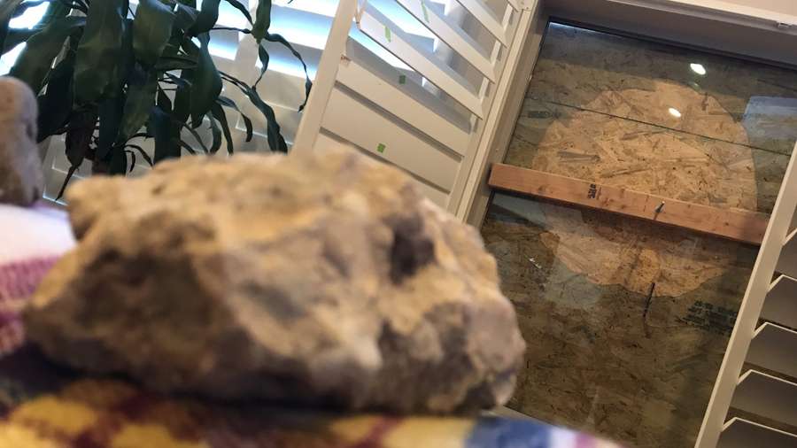 Dave Smellie said he and his wife discovered two large windows were broken and a chunk of concrete and a small rock had apparently been thrown through them on Friday, Jan. 31, 2020. Photo: Steve Breinholt, KSL TV