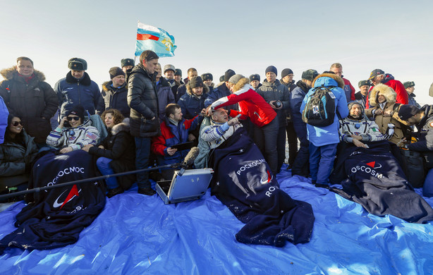 U.S. astronaut Christina Koch, left, Italian astronaut Luca Parmitano, right, and Russian cosmonaut Alexander Skvortsov sit in chairs shortly after the landing of the Russian Soyuz MS-13 space capsule about 150 km ( 80 miles) south-east of the Kazakh town of Zhezkazgan, Kazakhstan, Thursday, Feb. 6, 2020. A Soyuz space capsule with U.S. astronaut Christina Koch, Italian astronaut Luca Parmitano and Russian cosmonaut Alexander Skvortsov, returning from a mission to the International Space Station landed safely on Thursday on the steppes of Kazakhstan. (Photo: Sergei Ilnitsky, Pool Photo via AP)