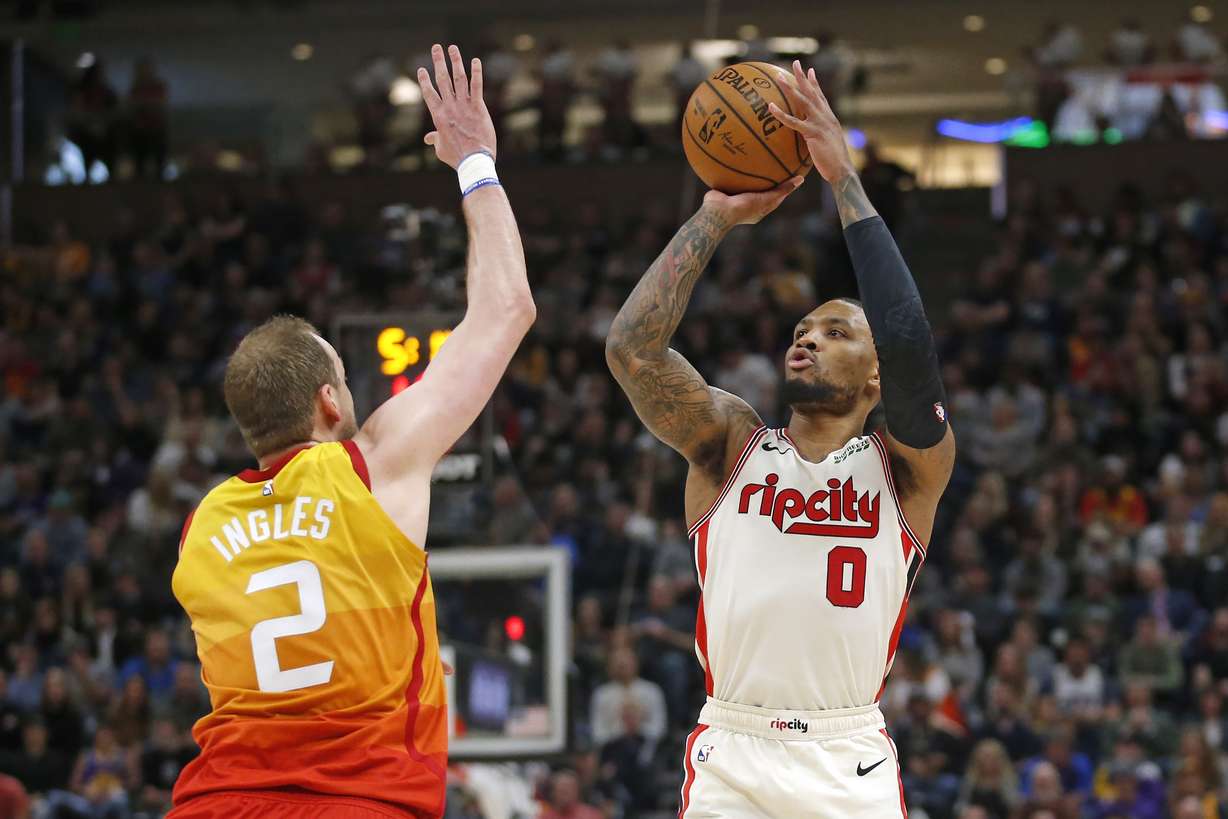 Portland Trail Blazers guard Damian Lillard (0) shoots as Utah Jazz guard Joe Ingles (2) defends during the first half of an NBA basketball game Friday, Feb. 7, 2020, in Salt Lake City. (Photo: Rick Bowmer, AP)