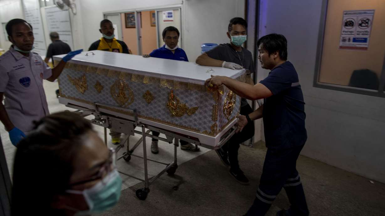 Families of Thai shooting victims wait for answers, bodies