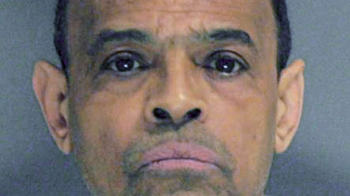Imprisoned ex-school dean pleads not guilty to gang charge