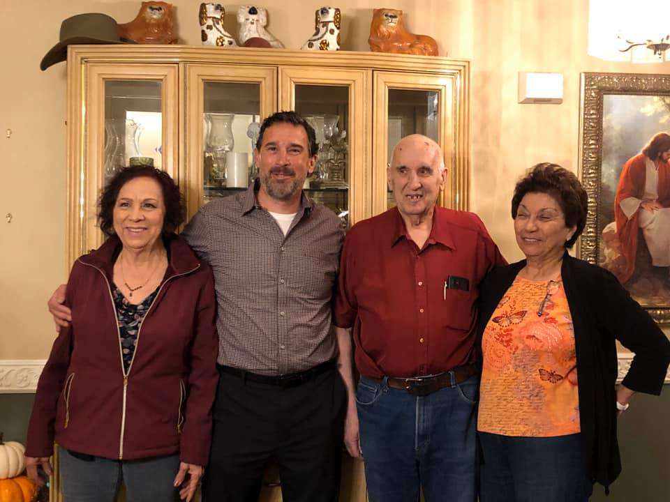 Juan Vasquez (center left) poses with his mother, Etelvina Strickland (left), his father, Stephen Bobowski (center right), and his father's wife, Yenia Bobowski (right). (Photo: Courtesy of Juan Vasquez)