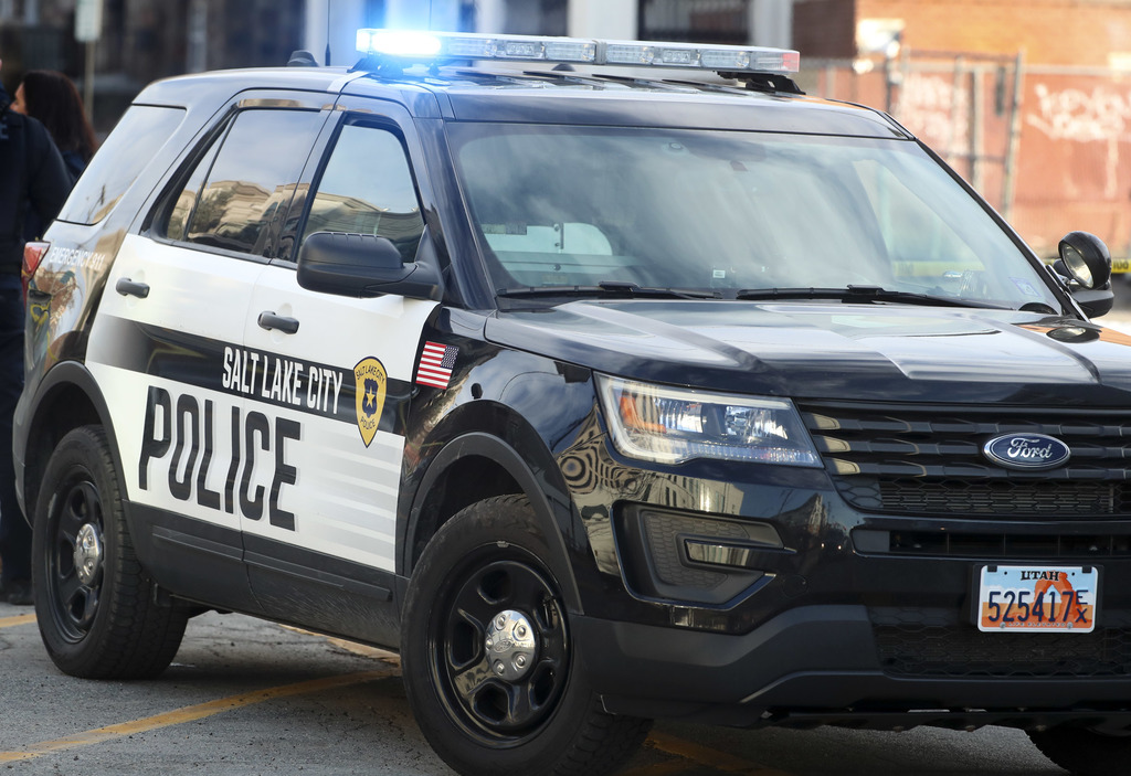 Salt Lake police say a man robbed a Walgreens and briefly held a customer hostage on Sunday.