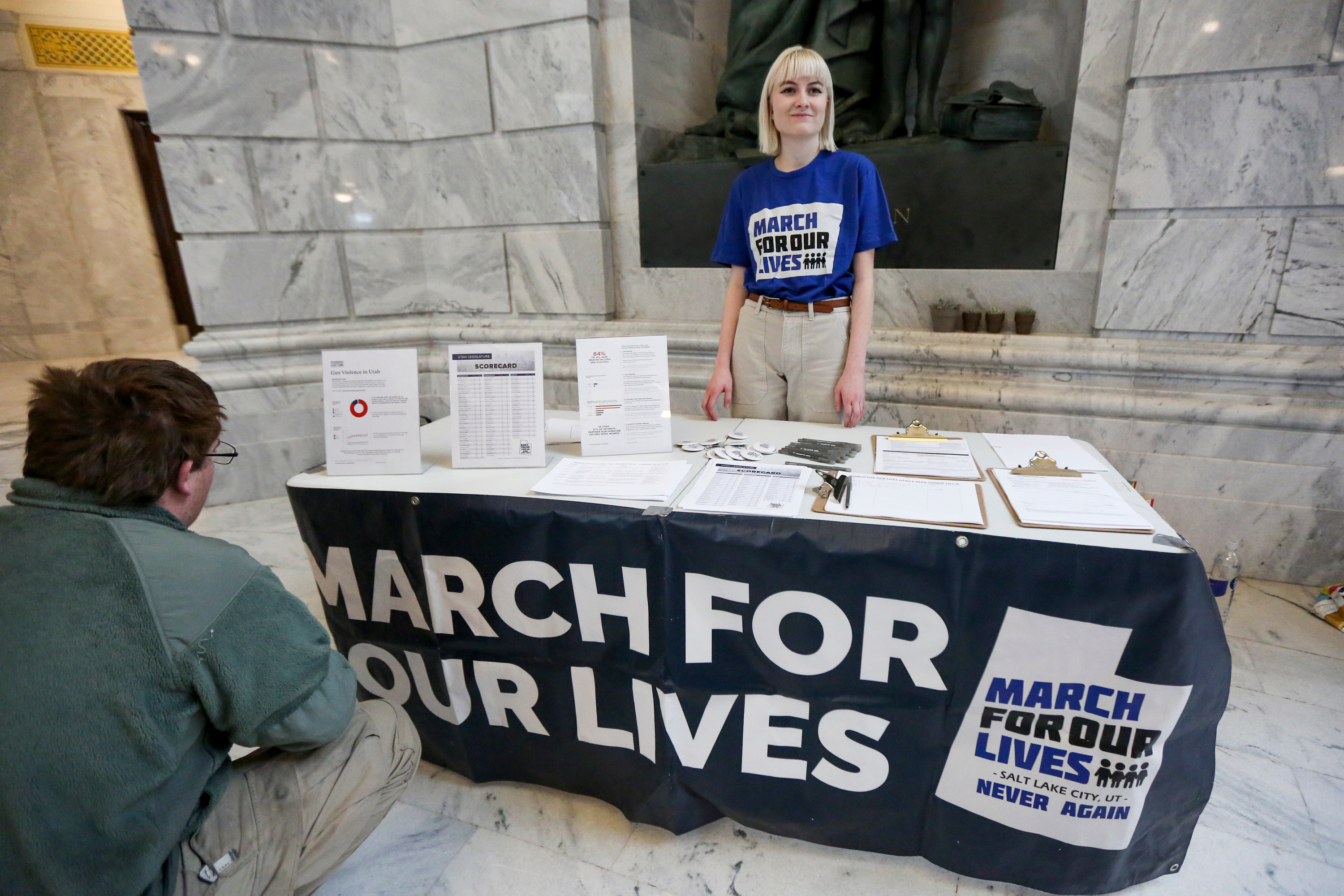 Ainsley Moench provides information at a booth before a rally held to show support for public safety bills that oppose gun violence at the Capitol in Salt Lake City on Saturday, Feb. 15, 2020. Organizers held the rally the day after the anniversary of when 17 people were killed two years ago at Stoneman Douglas High School in Parkland, Fla., and the week of the anniversary of the 2007 Trolley Square shooting. (Ivy Ceballo, KSL)