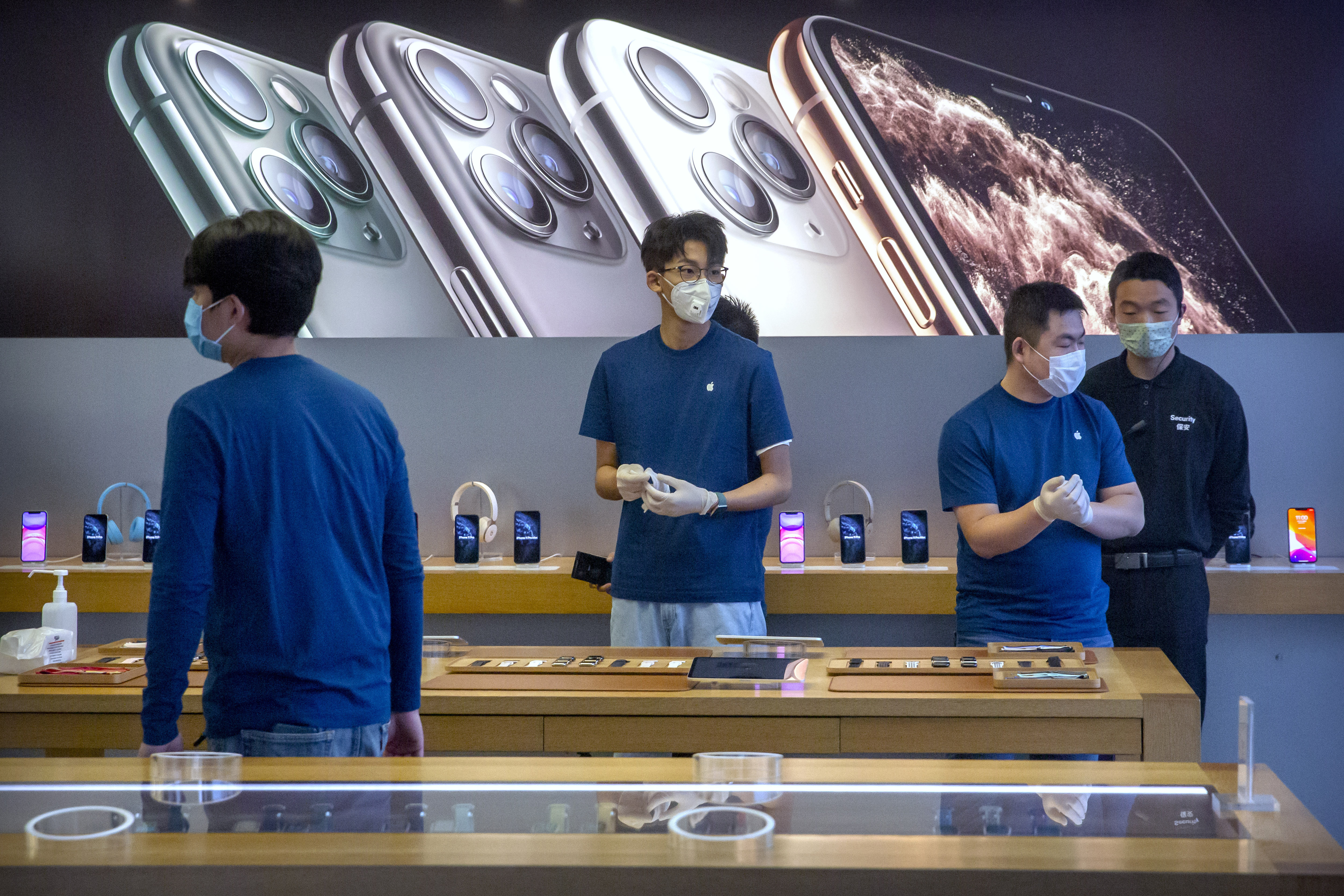 Apple warns China virus will cut iPhone production, sales