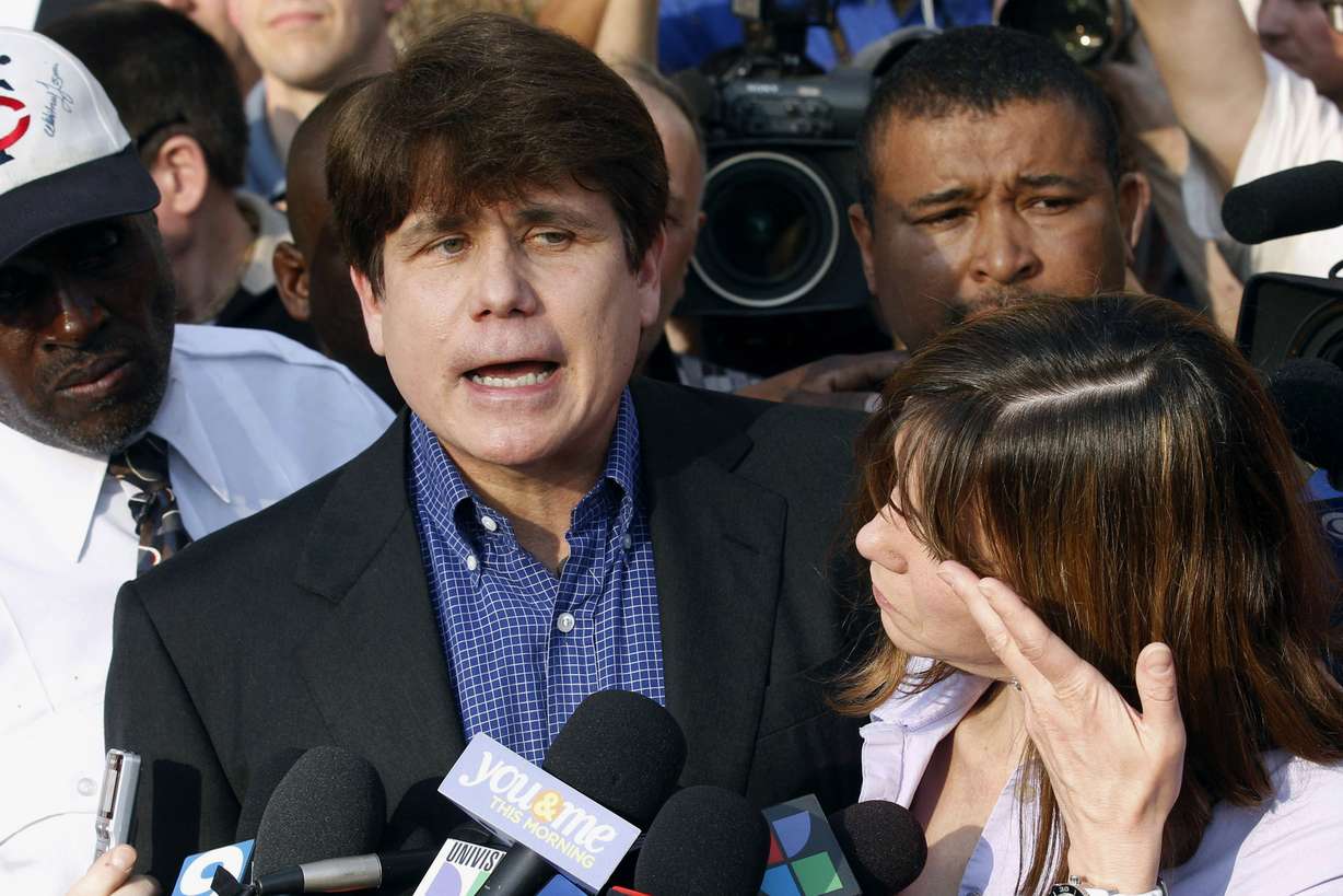 FILE — In this March 14, 2012, file photo, former Illinois Gov. Rod Blagojevich speaks to the media outside his home in Chicago as his wife, Patti, wipes away tears a day before reporting to prison after his conviction on corruption charges. The 63-year-old Democrat is expected to walk out of prison later Tuesday, Feb. 18, 2020. (M. Spencer Green, AP Photo, File)