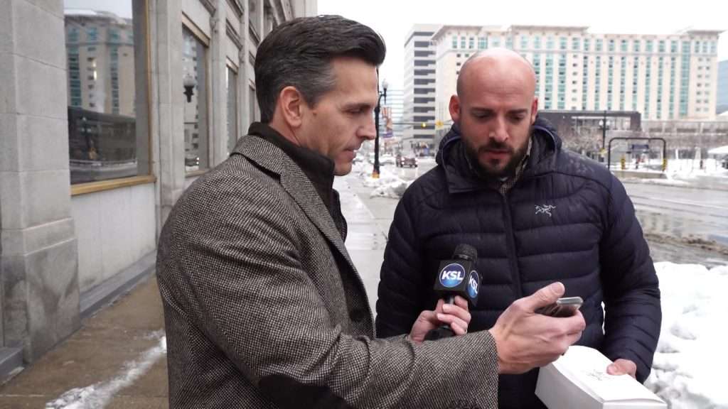 KSL Investigator Mike Headrick shows diners the list of restaurants in the bottom 10%. Photo: KSL TV