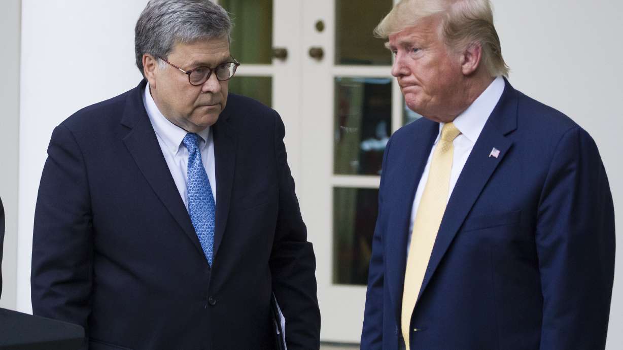 As Trump ups attacks on Justice Dept, Barr remains in post