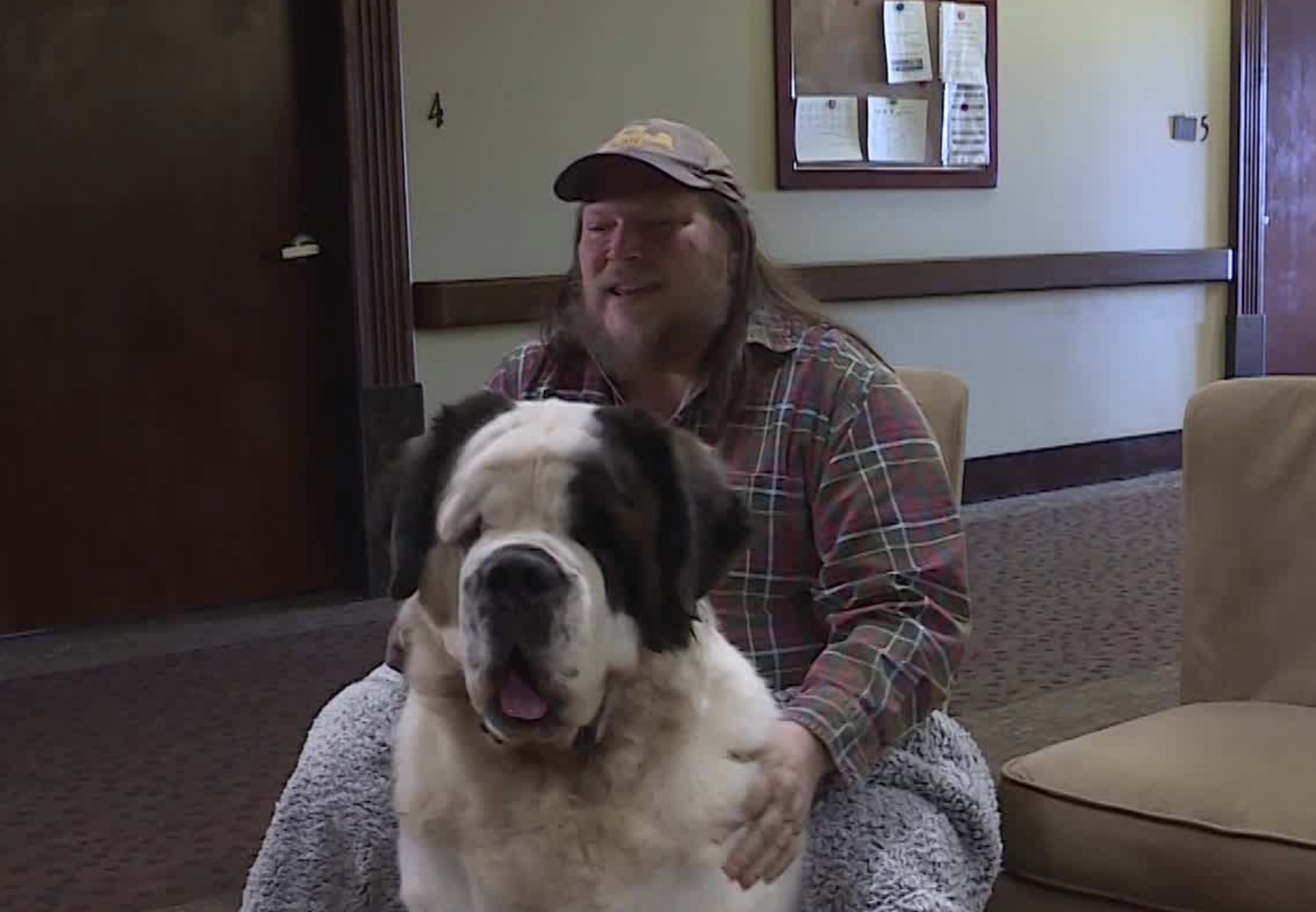 Michael Burton, 55, a former mathematics professor at University of Utah, Weber State and Salt Lake Community College is spending the last chapter of life with his St. Bernard, Ben, at The Inn Between. (Photo: Stuart Johnson, KSL TV)