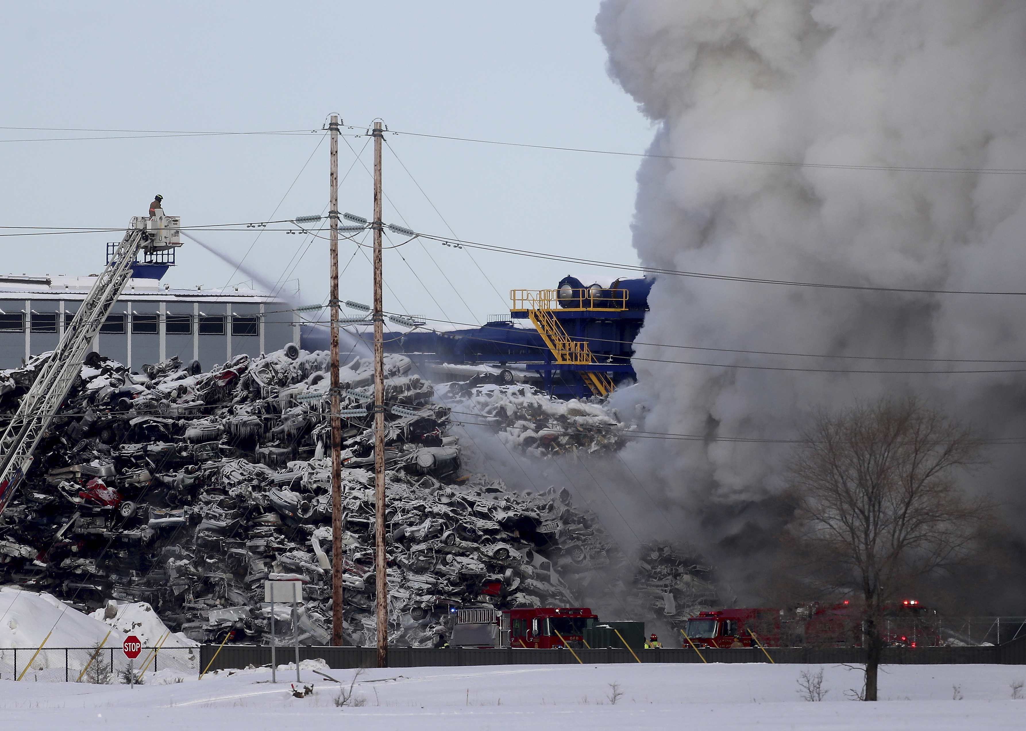 Police: Minnesota recycling plant fire under control for now