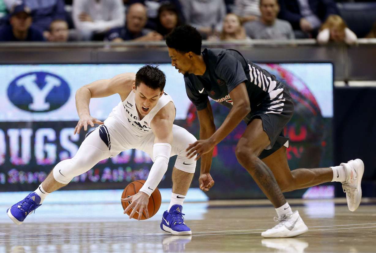 Brigham Young Cougars guard Alex Barcello (4) steals a loose ball from Santa Clara Broncos guard Tahj Eaddy (2) at Brigham Young University in Provo on Thursday, Feb. 20, 2020. (Photo: Laura Seitz, KSL)