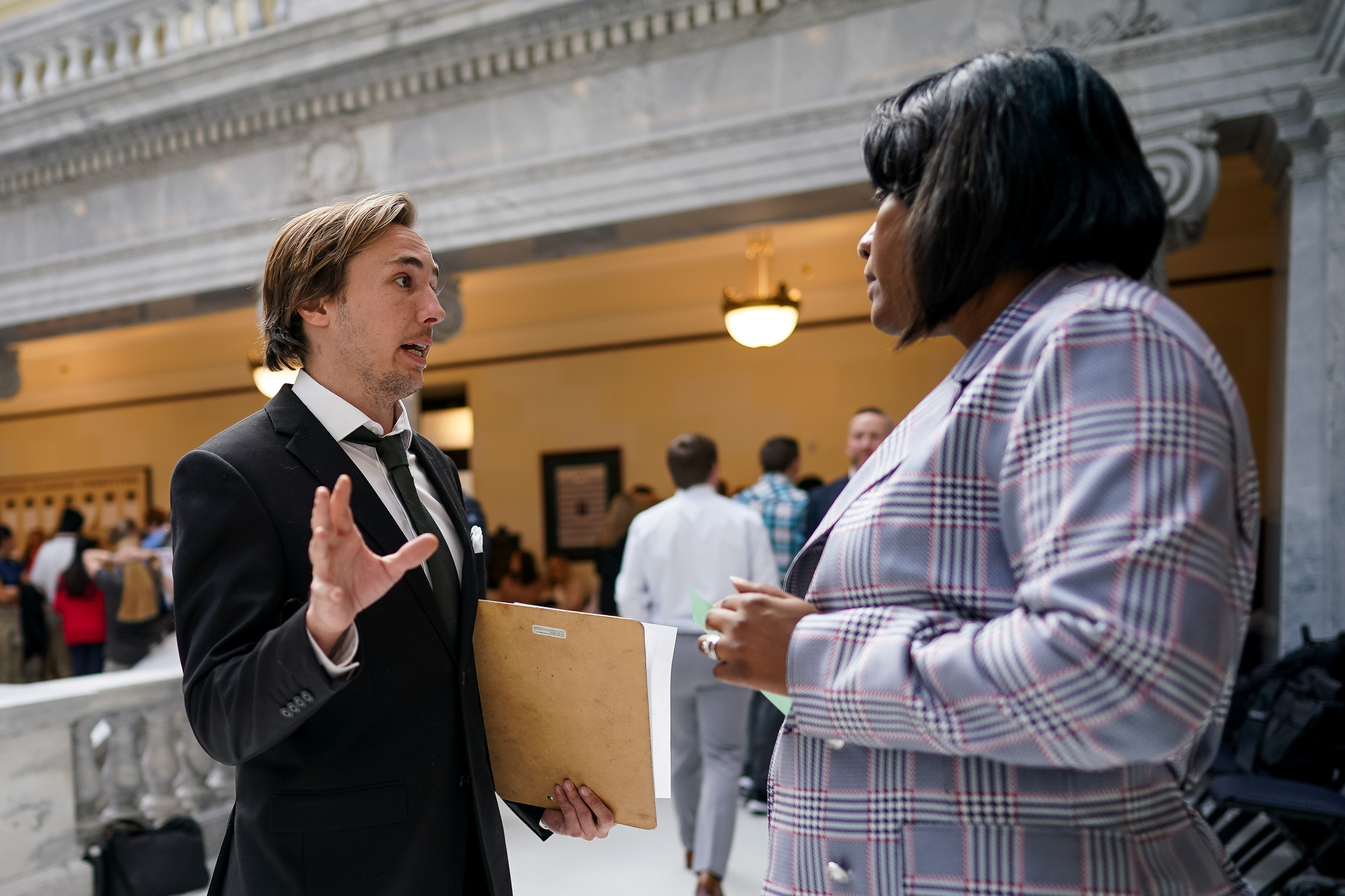 Darin Mann, action director with the SLC Air Protectors, left, speaks to Rep. Sandra Hollins, D-Salt Lake City, while lobbying against HB347, which relates to the inland port, at the Capitol in Salt Lake City on Thursday, Feb. 20, 2020. (Spenser Heaps, KSL)