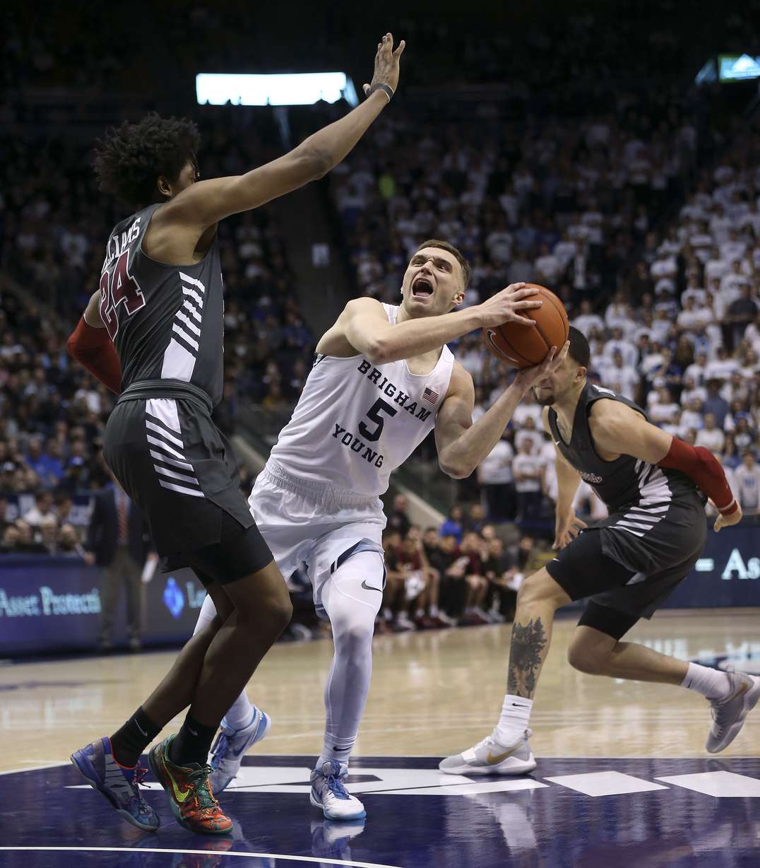 Brigham Young Cougars guard Jake Toolson (5) drives against Santa Clara Broncos guard Jalen Williams (24) at Brigham Young University in Provo on Thursday, Feb. 20, 2020. (Photo: Laura Seitz, KSL)