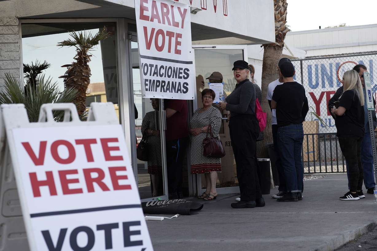 In this Feb. 15, 2020, file photo, people wait in line at an early voting location at the culinary workers union hall in Las Vegas. The Democratic presidential contest has moved to immigrant-heavy Nevada, but the issues of immigration are seldom getting a thorough airing on the campaign trail. Candidates usually throw in a quick condemnation of President Donald Trump's hard-line policies but have shied away from outlining their own immigration positions. Immigration groups say that points to a potential vulnerability for whoever is the Democratic nominee later this year. (Photo: John Locher, AP Photo, File)