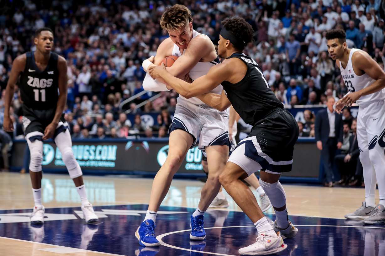 Brigham Young Cougars guard Zac Seljaas (2) pulls the ball away from Gonzaga Bulldogs guard Admon Gilder (1) at the Marriott Center in Provo on Saturday, Feb. 22, 2020. (Photo: Spenser Heaps, KSL)