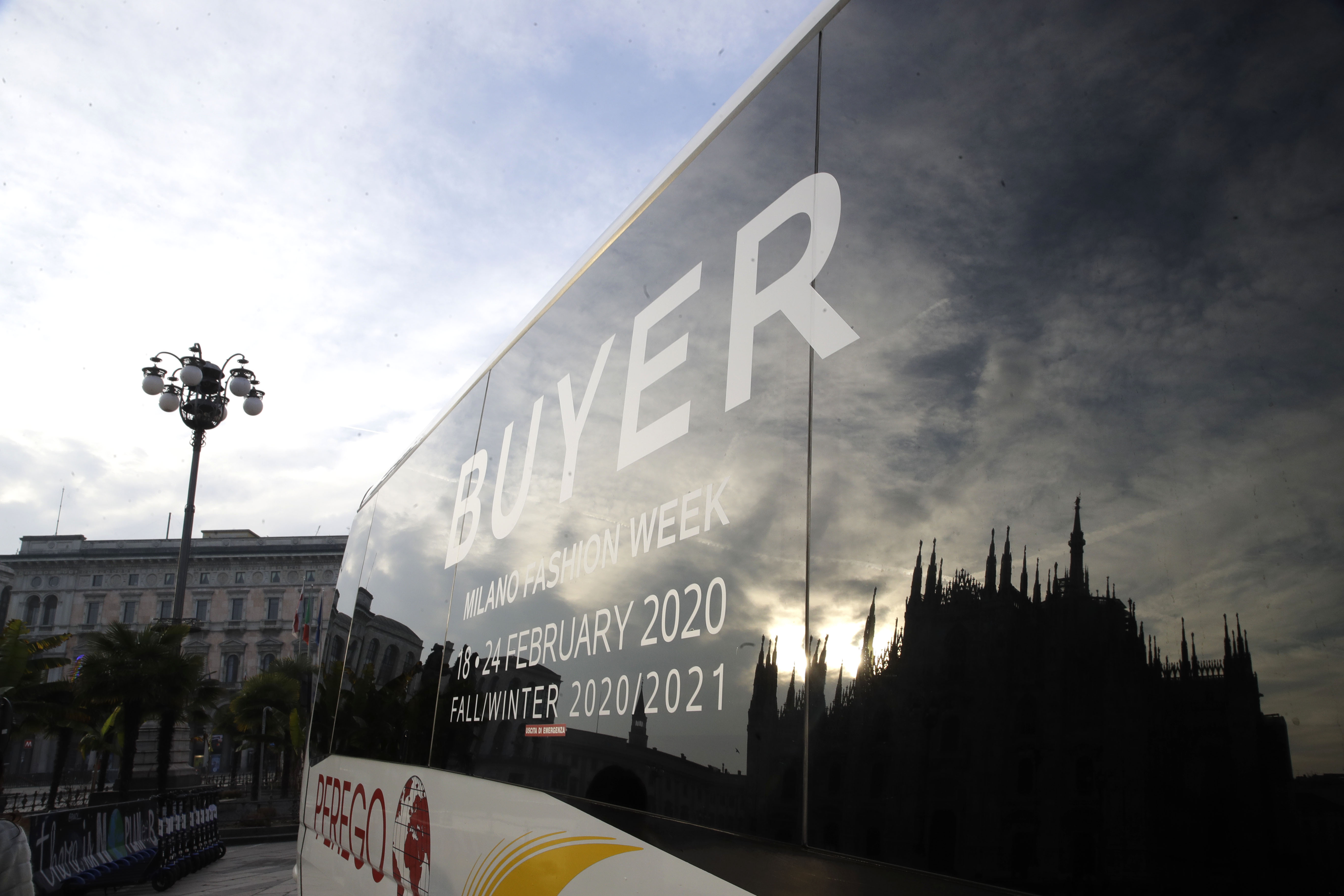 Virus closes doors at Armani, but other Milan shows go on