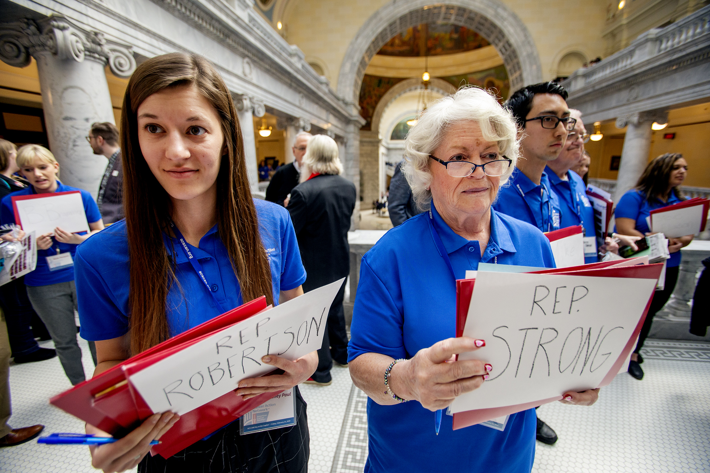 Delaney Paul, left, waits to talk with Rep. Adam Robertson, R-Provo, and Sharon Folland waits to talk with Rep. Mark Strong, R-Bluffdale, as cancer survivors and advocates gather at the Capitol in Salt Lake City on Friday, Feb. 21, 2020, to urge legislators to support HB34, which would prohibit anyone under the age of 18 from using an indoor tanning device. (Photo: Scott G Winterton, KSL)