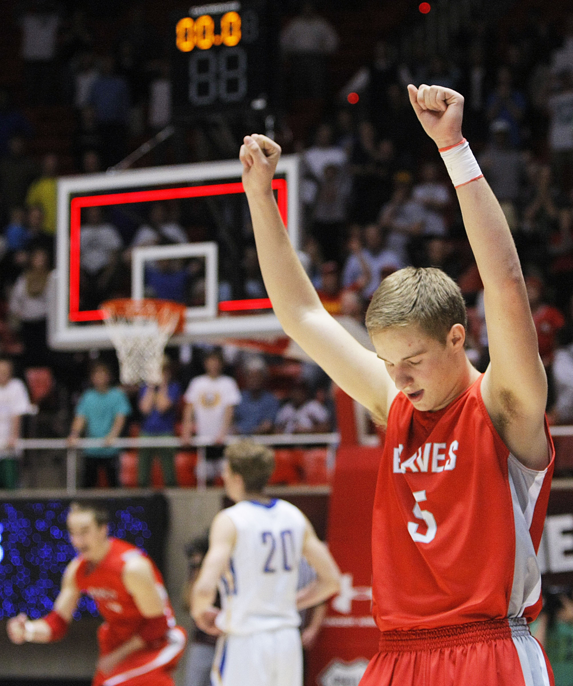 Bountiful's Sam Merrill raises his arms in victory as Bountiful defeats Orem Saturday, March 8, 2014 for the 4A State championship 44-43 in the Huntsman Center at the University of Utah. Bountiful won . (Photo: Scott G Winterton, KSL)