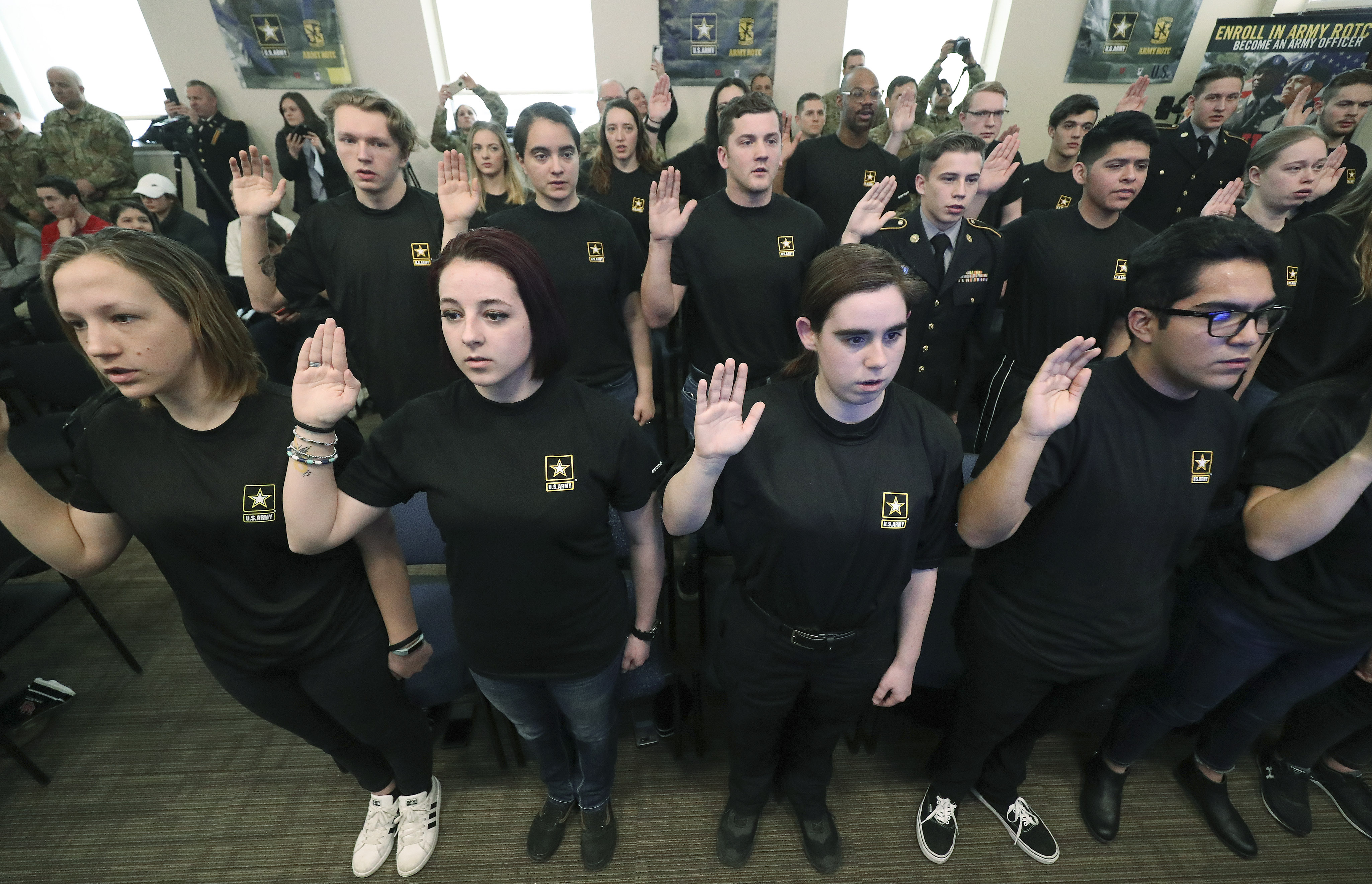 Soldiers-to-be raise their hands during a U.S. Army oath of enlistment ceremony at the University of Utah in Salt Lake City on Wednesday, Feb. 26, 2020. The oath was administered by U.S. Army Col. and NASA astronaut Andrew Morgan from the International Space Station. More than 850 future soldiers participated in the ceremony, the product of a partnership between NASA and U.S. Army Recruiting Command, at more than 130 locations across the country. (Jeffrey D Allred, KSL)