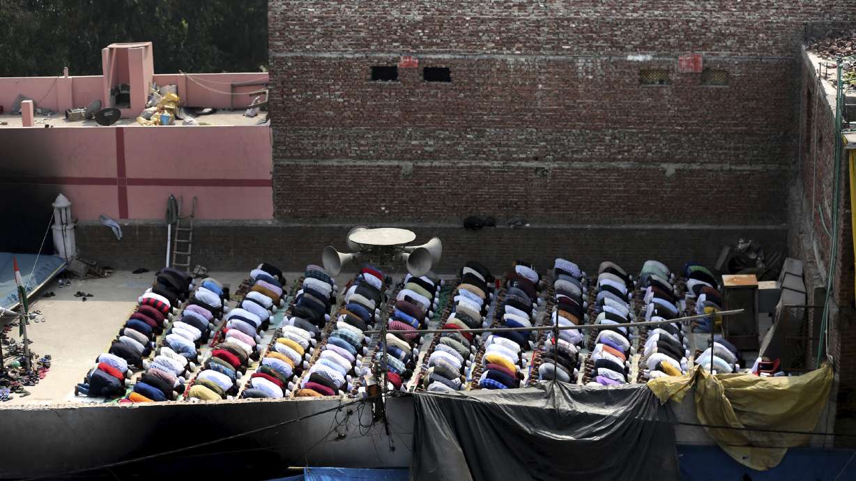 Prayers at fire-bombed mosques as India's riot toll grows