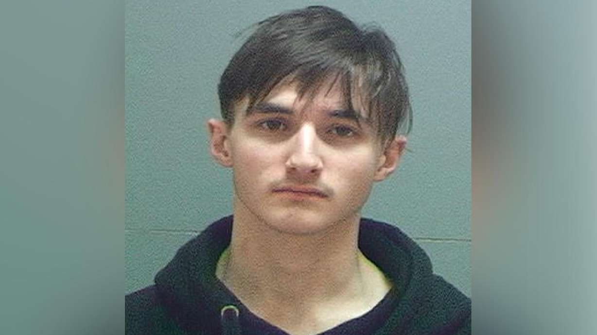 Man arrested with rifle and drugs was recruiting boy for gang, police say