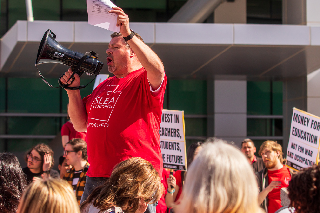 Mike Harman, a counselor in the Salt Lake City School District and Salt Lake Education Association vice president, leads a group of teachers, parents and students in a chant while outside the Wallace F. Bennett Federal Building in Salt Lake City on Friday, Feb. 28, 2019. The group demanded legislators to increase funding for Utah students. (Photo: Carter Williams, KSL.com)